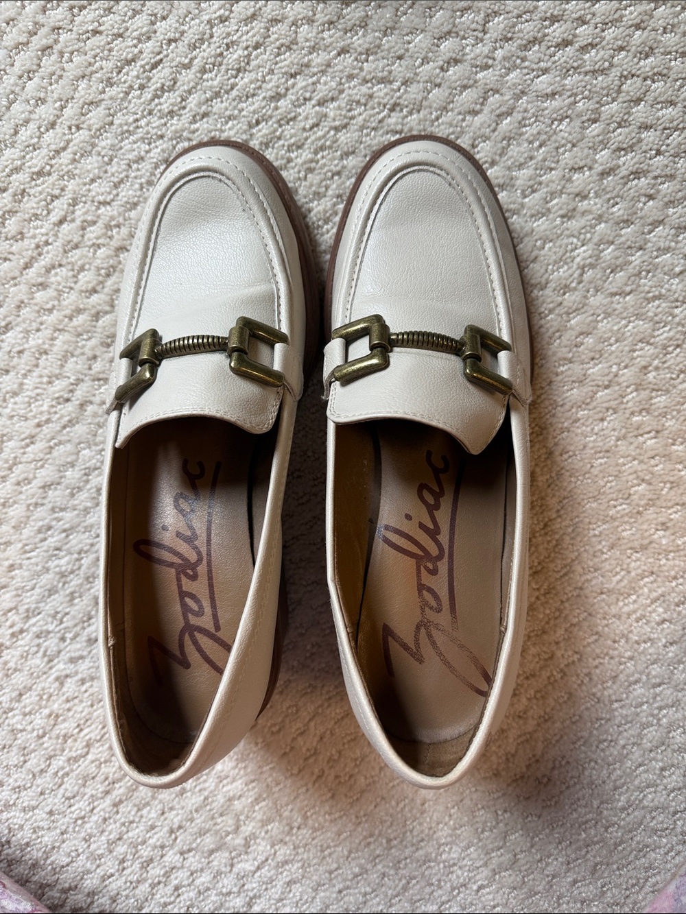 Zodiac off-white loafers with brass hardware